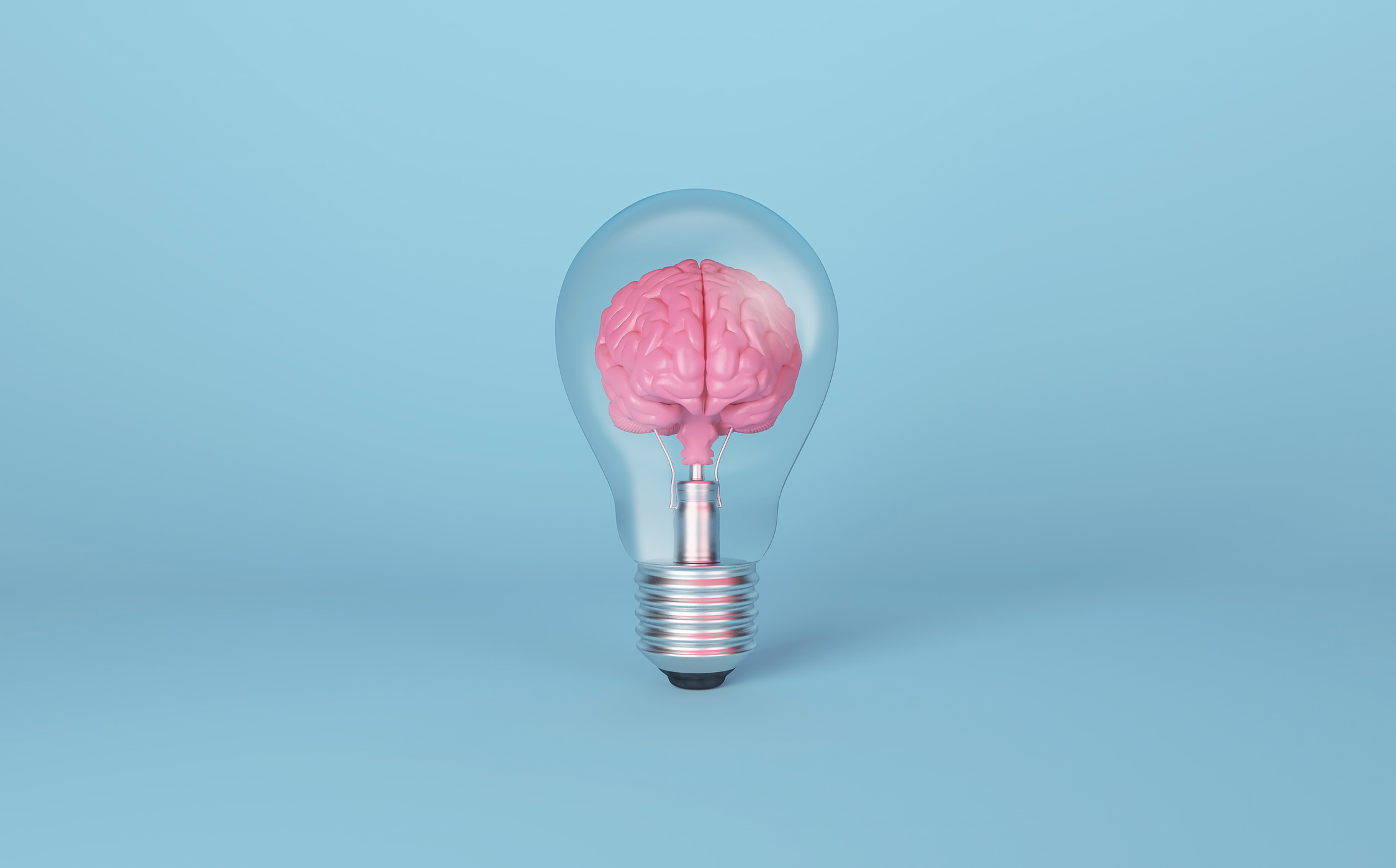 Brain on light bulb on blue background. Concept of inspiration, creativity, idea, innovation.